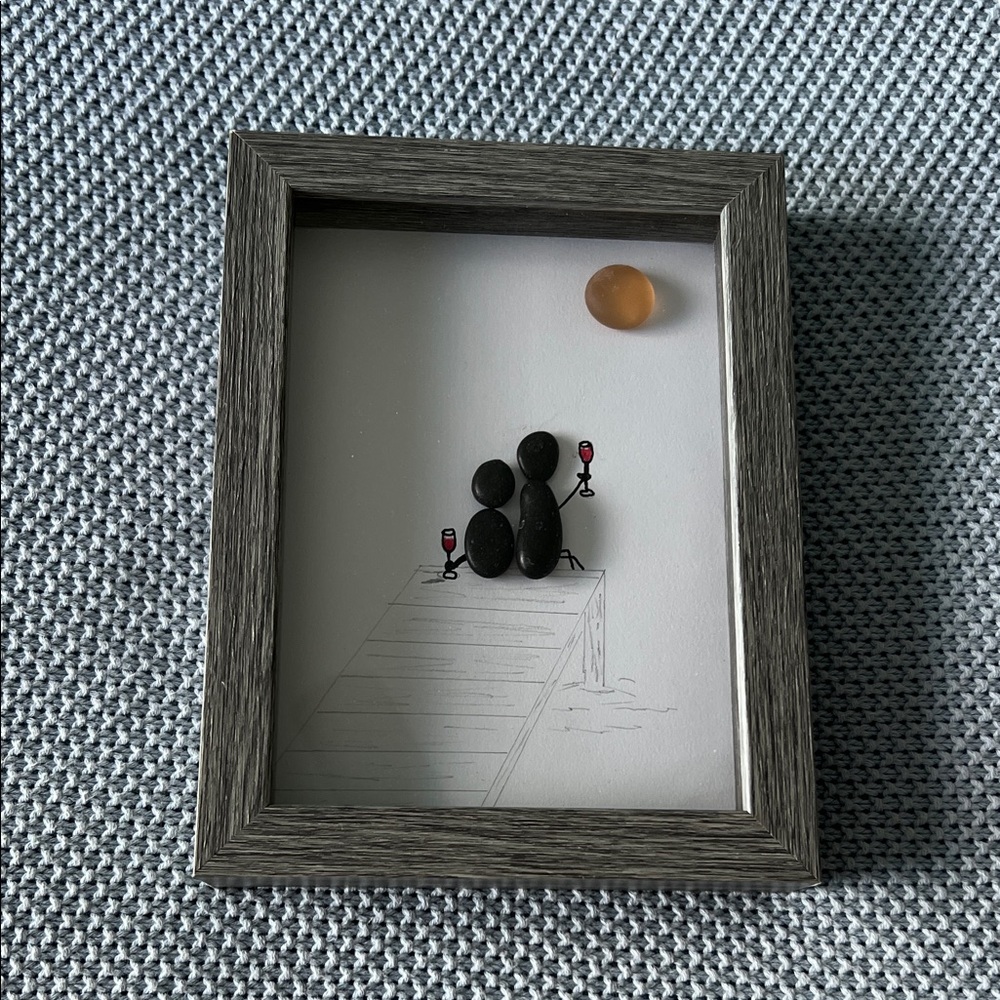 Pebble Art Couple On Dock